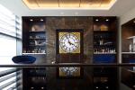 Image of large wall clock and the United Club bar