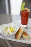 Image of hard boiled eggs, bread sticks, and a beverage