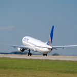 Image of United Boeing 737 plane taking off on runway