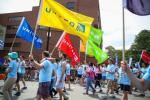 United employees holding colorful United flags in the 2015 Chicago Pride Parade