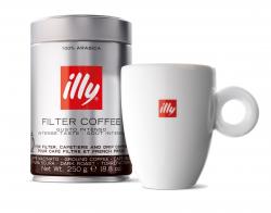 Can of Illy brand coffee beans next to coffee cup