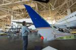 Image of a United technician install a new Split Scimitar Winglet on a Boeing 737-800 aircraft