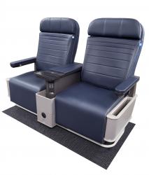 Two blue airplane seats, side-by-side