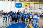 United employees with the Warriors Dance team and players Shaun Livingston, Zaza Pachulia and James Michael McAdoo