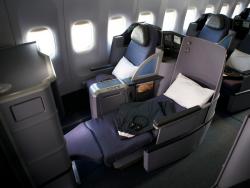 Two blue Business Class airplane seats.