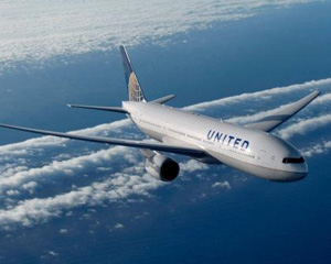 United Jetliner flying over the ocean